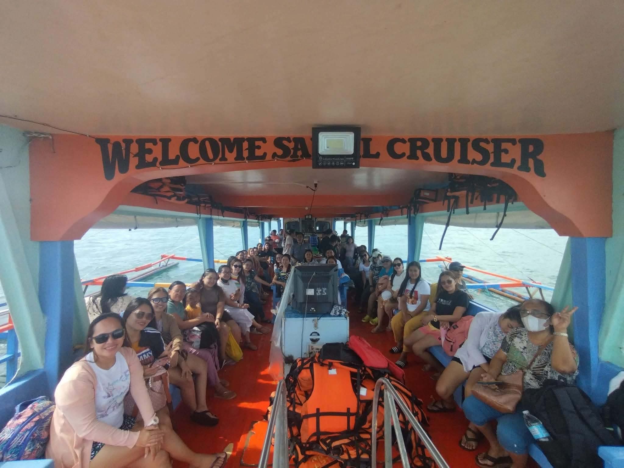 Welcome Samal Cruiser boat interior with passengers seated and enjoying the ride